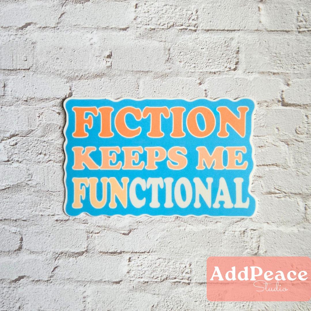 Sticker with 'FICTION KEEPS ME FUNCTIONAL' text on a white brick wall, featuring the brand 'AddPeace Studio'.