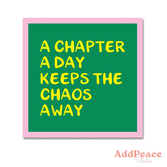 Green sticker with yellow text 'A chapter a day keeps the chaos away' and pink border, AddPeace Studio logo at the bottom.