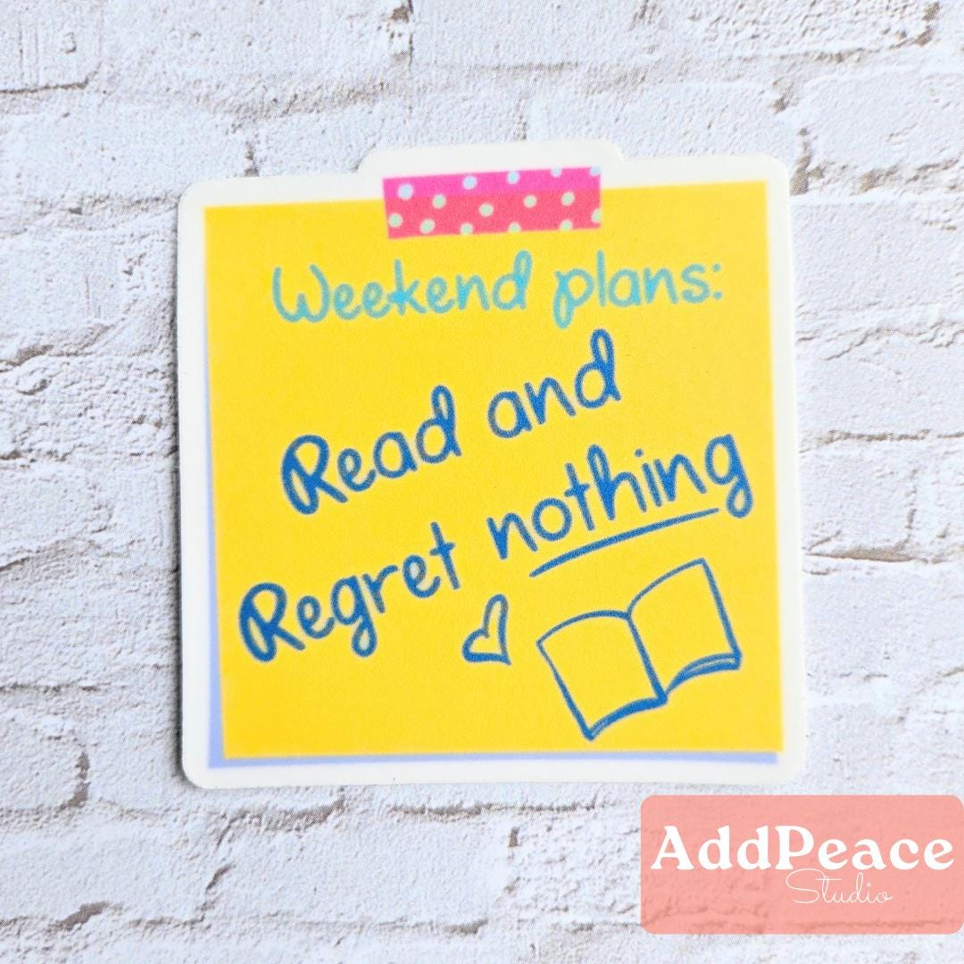 Yellow sticky note with 'Weekend plans: Read and Regret nothing' text on a white brick wall background.