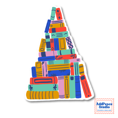 A die-cut sticker featuring a colorful stack of books arranged in a triangular shape, shown on a plain white background with an AddPeaceStudio logo in the bottom right corner.