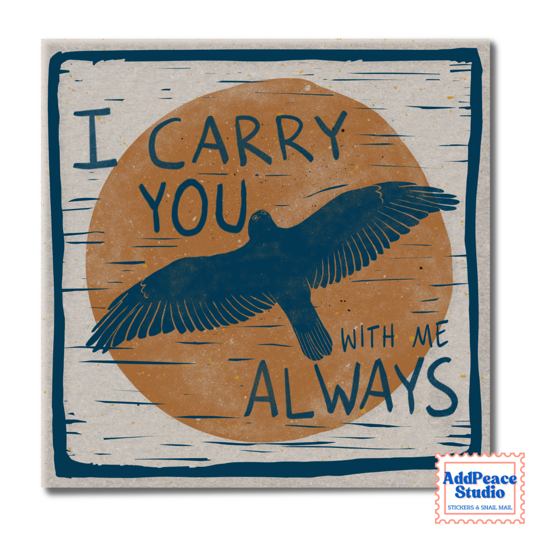 A square sticker with a rustic wood-grain texture, featuring a navy blue bird silhouette flying over a large tan circle with the text 'I CARRY YOU WITH ME ALWAYS' in navy blue. A small 'AddPeace Studio' watermark is visible in the bottom right corner.