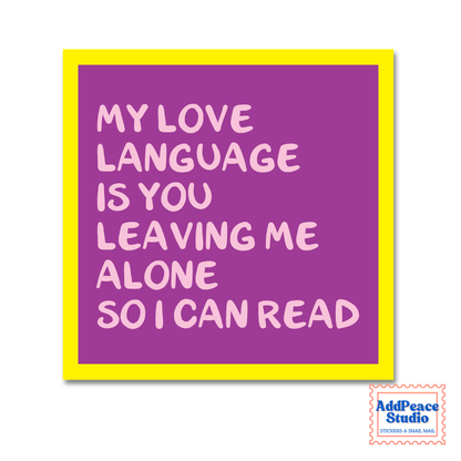 A square sticker with a bright yellow border and a purple background, featuring the text 'MY LOVE LANGUAGE IS YOU LEAVING ME ALONE SO I CAN READ' in light pink lettering. The AddPeaceStudio logo is visible in the bottom right corner.
