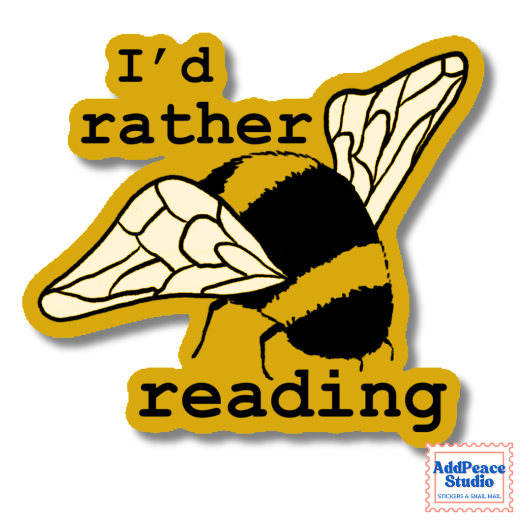 A die-cut sticker featuring a bumblebee illustration and the text 'I'd rather reading' in black on a mustard yellow background, with a small AddPeace Studio logo in the bottom right corner.