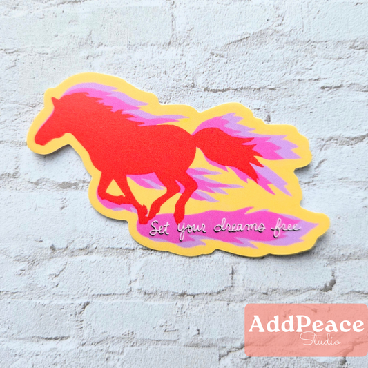 Colorful horse-shaped sticker with 'Set your dreams free' text on a textured light blue background, featuring the AddPeace Studio logo.