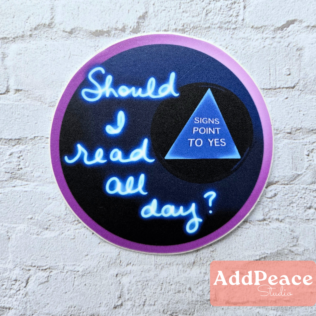 Illustrated magic 8 ball sticker with the phrase “Should I Read All Day? Signs Point to Yes”
