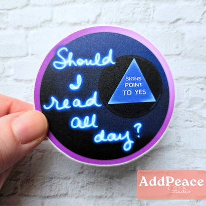 Magic 8 Ball book lover sticker with “Should I Read All Day? Signs Point to Yes” text