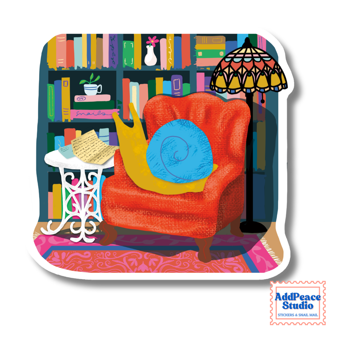 A die-cut sticker featuring a colorful illustration of a cozy reading nook with a red armchair, snail reading mail, a bookshelf, and a stained-glass lamp. The sticker is shown on a white background with an 'AddPeace Studio' logo in the bottom right corner