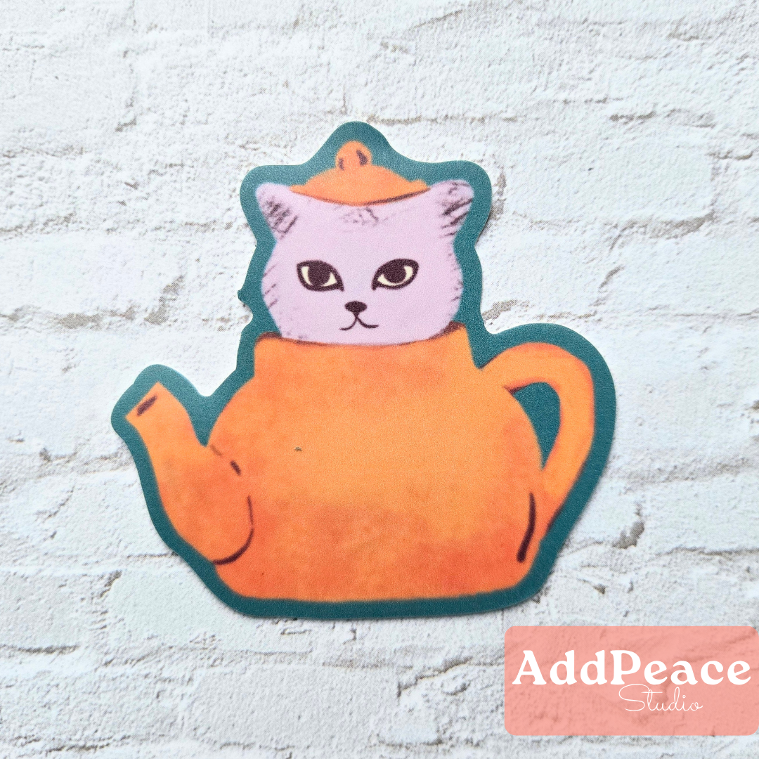 Cat-shaped teapot sticker on a textured white background with 'AddPeace Studio' branding.