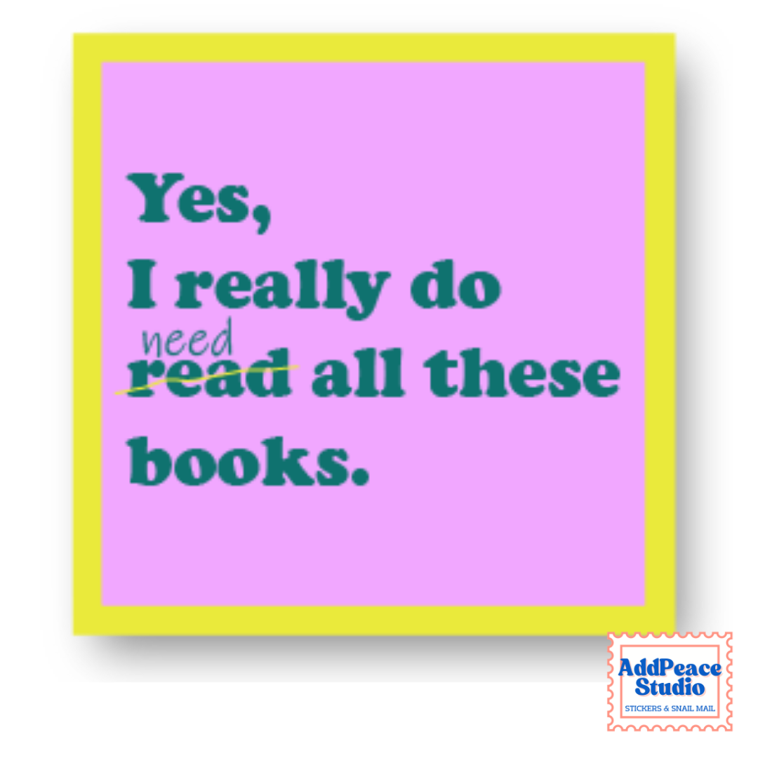 A square pink sticky note with a bright yellow border, featuring the quote 'Yes, I really do need/read all these books.' in teal text.