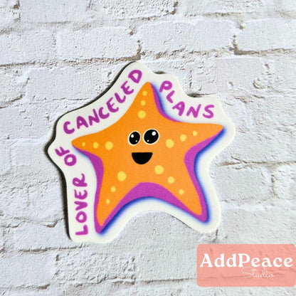 Star-shaped sticker with text 'Canceled Plans Lover' on a white brick background, featuring the brand 'AddPeace'.
