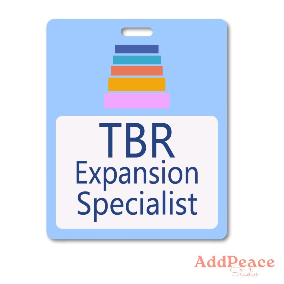 Sticker badge with 'TBR Expansion Specialist' text on a blue background, featuring colorful books above the text.