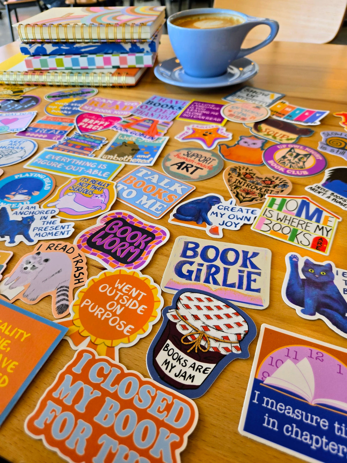 Fun, colorful stickers laid out on a wooden table